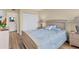 Charming bedroom with full-size bed and access to bathroom at 5855 Midnight Pass Rd # 420, Sarasota, FL 34242