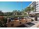 Community grills nestled amongst lush tropical landscaping at 5855 Midnight Pass Rd # 420, Sarasota, FL 34242