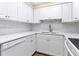 Modern white kitchen with updated fixtures and white cabinetry at 5855 Midnight Pass Rd # 420, Sarasota, FL 34242