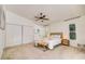 Main bedroom with a queen bed, large closet, and window at 7305 Mauna Loa Blvd, Sarasota, FL 34241