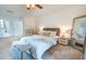 Main bedroom with a king-size bed and calming decor at 7305 Mauna Loa Blvd, Sarasota, FL 34241