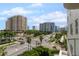 This balcony offers views of the city and palm trees at 128 Golden Gate Pt # 501B, Sarasota, FL 34236