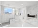 Modern bathroom with sleek vanity, spacious glass shower, and luxurious marble tiling at 128 Golden Gate Pt # 501B, Sarasota, FL 34236