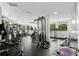 A well-equipped gym with a variety of weight machines, treadmills, and free weights at 128 Golden Gate Pt # 501B, Sarasota, FL 34236