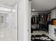 Hallway featuring access to a walk-in closet at 128 Golden Gate Pt # 501B, Sarasota, FL 34236
