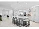 Open-concept kitchen with large island, modern appliances, sleek countertops, and bright lighting at 128 Golden Gate Pt # 501B, Sarasota, FL 34236