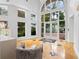 A modern lobby with stylish seating, large windows, and elegant tile flooring at 128 Golden Gate Pt # 501B, Sarasota, FL 34236