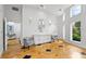 Open-concept lobby area with tiled floors, modern furniture, and natural lighting at 128 Golden Gate Pt # 501B, Sarasota, FL 34236