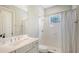 Bathroom featuring neutral colors, shower with curtain, single sink vanity, and an overhead window at 16916 Rosedown Gln, Parrish, FL 34219