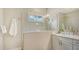 Bathroom features a glass shower enclosure and single sink vanity with great lighting at 16916 Rosedown Gln, Parrish, FL 34219