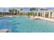 Resort-style pool with palm trees and cabana, perfect for relaxation and community gathering at 16916 Rosedown Gln, Parrish, FL 34219
