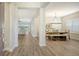 Inviting entryway showcases the home's open layout and elegant dining area with wood floors at 16916 Rosedown Gln, Parrish, FL 34219