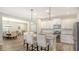 Modern kitchen features white cabinetry, granite countertops, and stainless steel appliances at 16916 Rosedown Gln, Parrish, FL 34219