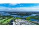 Aerial view of the community featuring lush landscaping, waterfront views, and vibrant greenery at 3333 26Th E Ave # 1230, Bradenton, FL 34208