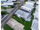 Aerial view of homes showcasing the community layout, landscaping, and modern metal roof at 3333 26Th E Ave # 1230, Bradenton, FL 34208