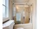 Clean bathroom with a shower featuring a sliding glass door and a convenient towel rack at 3333 26Th E Ave # 1230, Bradenton, FL 34208