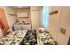 Bedroom featuring a bed, laundry machine, closet and window at 3333 26Th E Ave # 1230, Bradenton, FL 34208