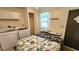 Bedroom featuring a bed, laundry machine, closet and exterior door at 3333 26Th E Ave # 1230, Bradenton, FL 34208
