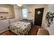 Bedroom featuring a bed, laundry machine, closet and exterior door at 3333 26Th E Ave # 1230, Bradenton, FL 34208