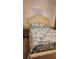 Bright bedroom features a comfortable bed with a stylish blue and white patterned quilt at 3333 26Th E Ave # 1230, Bradenton, FL 34208