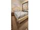 Cozy bedroom with cream-colored bed frame, blue and white quilt, and mirrored closet at 3333 26Th E Ave # 1230, Bradenton, FL 34208