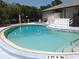 Community pool with shallow end and easy-access handrails for residents and guests at 3333 26Th E Ave # 1230, Bradenton, FL 34208