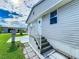 Charming home with horizontal siding and a cozy front entrance with stairs and railing at 3333 26Th E Ave # 1230, Bradenton, FL 34208