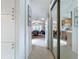 Hallway view with white cabinets leading into the living room and kitchen area at 3333 26Th E Ave # 1230, Bradenton, FL 34208