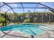 Inviting screened pool with fountain feature at 7745 Sandhill Lake Dr, Sarasota, FL 34241