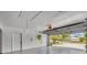 Attached garage with overhead storage and epoxy floor at 2806 67Th W St, Bradenton, FL 34209