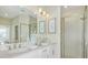 Double vanity bathroom with quartz countertop and walk in shower at 23887 Collina Way # 5104, Port Charlotte, FL 33980