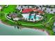 Aerial view showing resort-style pool, playground, and clubhouse at 5712 Hevena Ct, Palmetto, FL 34221