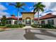 gated community pool entrance with lush landscaping at 5712 Hevena Ct, Palmetto, FL 34221