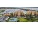 Aerial view showing community, marina, and tennis courts at 606 Riviera Dunes Way # 303, Palmetto, FL 34221