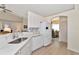 White kitchen with stainless steel appliances and quartz countertops at 2289 Charleston Park Dr, North Port, FL 34287