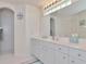 Double vanity with a large mirror and adjacent shower at 2289 Charleston Park Dr, North Port, FL 34287