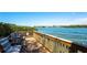 Enjoy this waterfront deck with seating and beautiful water views at 6263 Midnight Pass Rd # 301, Sarasota, FL 34242