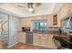 Modern kitchen with granite countertops and stainless steel appliances at 6263 Midnight Pass Rd # 301, Sarasota, FL 34242