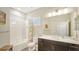 Charming bathroom with a bathtub, shower, and vanity at 16916 Rosedown Gln, Parrish, FL 34219