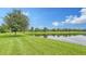 Serene lakefront property with lush landscaping and beautiful homes at 16916 Rosedown Gln, Parrish, FL 34219