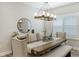 Bright dining room featuring a wood table and stylish chandelier at 16916 Rosedown Gln, Parrish, FL 34219