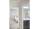 View of bathroom with a double vanity and access to bedroom at 16916 Rosedown Gln, Parrish, FL 34219