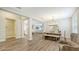 Open dining room with wood table and chandelier at 16916 Rosedown Gln, Parrish, FL 34219
