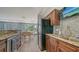 Well-equipped community kitchen with granite counters and stainless steel appliances at 603 Longboat Club Rd # 602N, Longboat Key, FL 34228