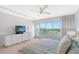Bright bedroom with golf course views and a floating bed at 603 Longboat Club Rd # 602N, Longboat Key, FL 34228