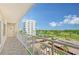 Private balcony overlooking golf course and partial bay view at 603 Longboat Club Rd # 602N, Longboat Key, FL 34228