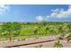 Stunning view of golf course, bay, and palm trees at 603 Longboat Club Rd # 602N, Longboat Key, FL 34228
