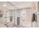 Bathroom with shower/tub combo, marble tile, and updated fixtures at 603 Longboat Club Rd # 602N, Longboat Key, FL 34228