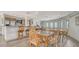 Community room with kitchen, dining tables and ocean view at 603 Longboat Club Rd # 602N, Longboat Key, FL 34228
