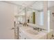 Elegant bathroom with double vanity and large mirrors at 603 Longboat Club Rd # 602N, Longboat Key, FL 34228